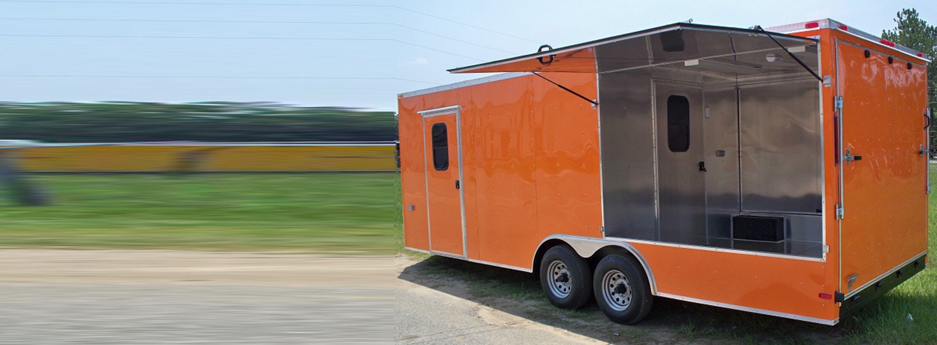 An orange food truck parked on a gravel surface.